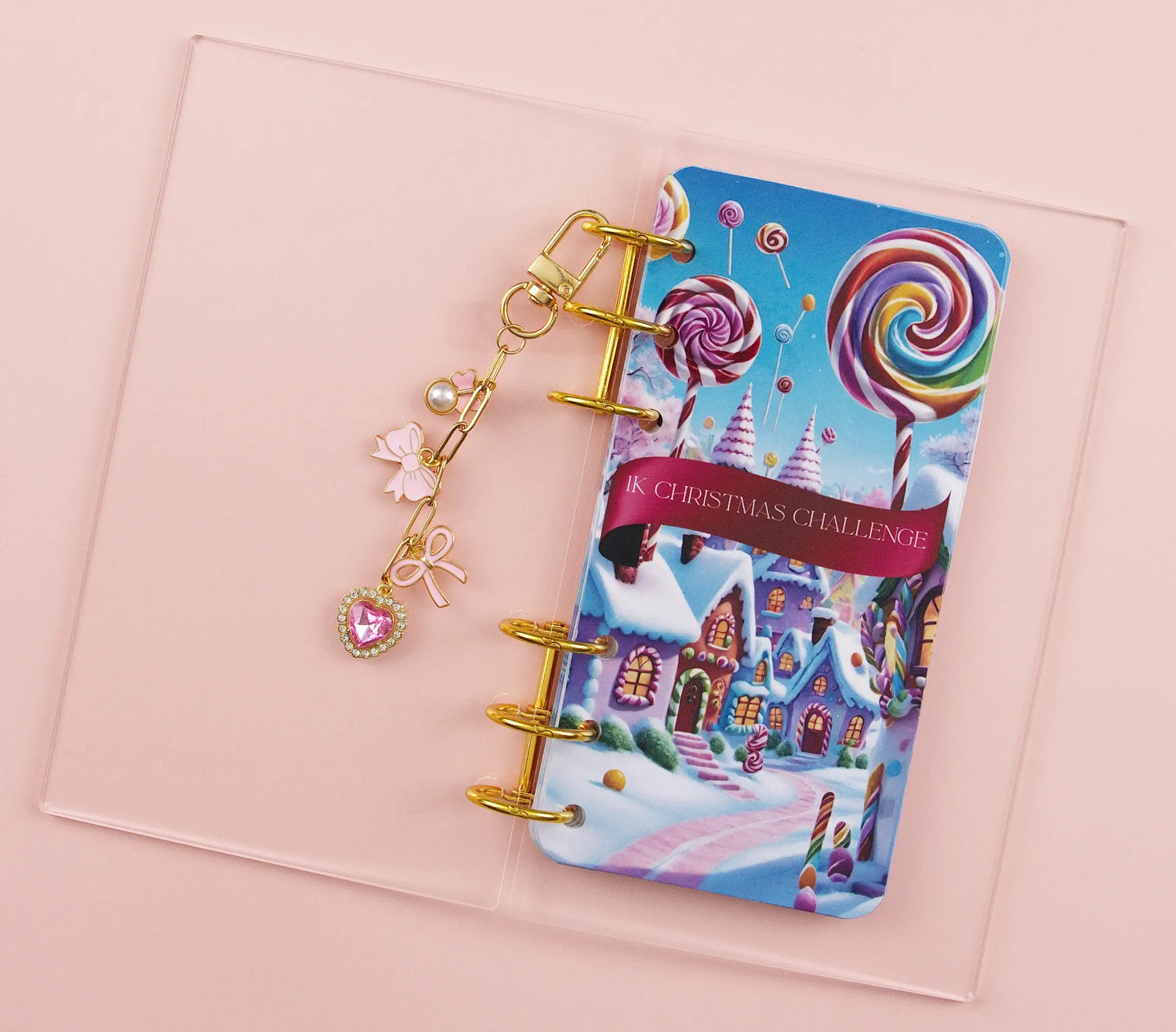 christmas themed banner inside acrylic binder on pink background