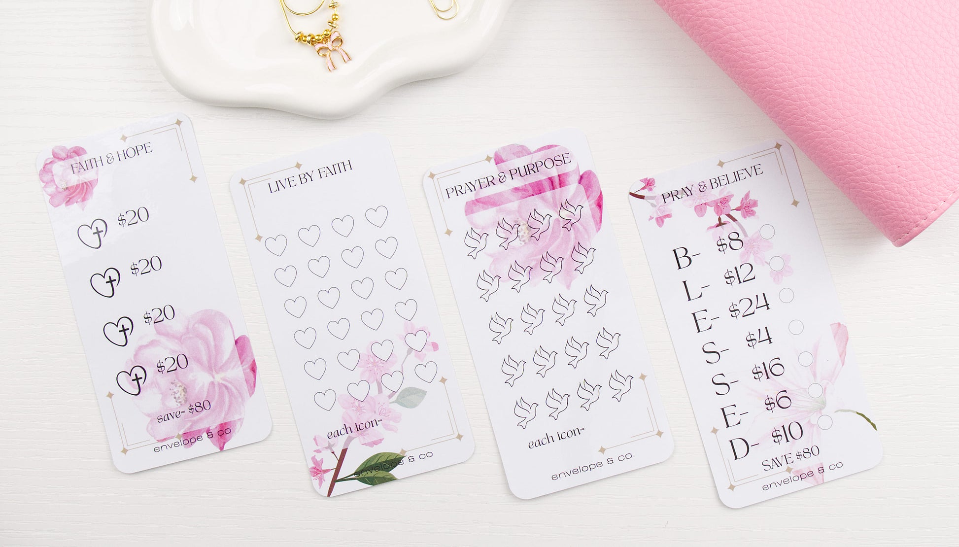 Set of savings challenges with floral and prayer designs on a white surface.