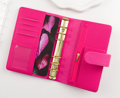 Pink binder with a floral dashboard on a white background