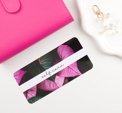 leaf designed envelope insert on white background with pink binder and charm in the corners