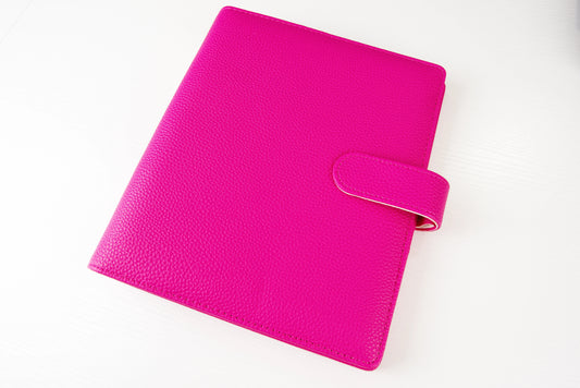 Pink binder on a white background