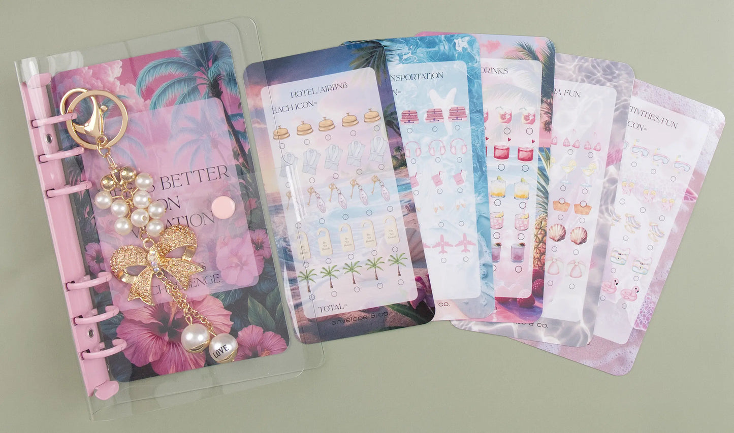 Binder bundle with a pink and floral design on a green background