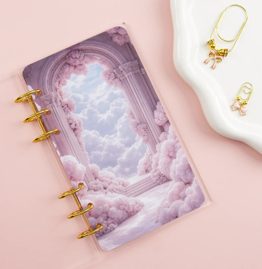 Clear binder with cloud design and gold accents on a pink background