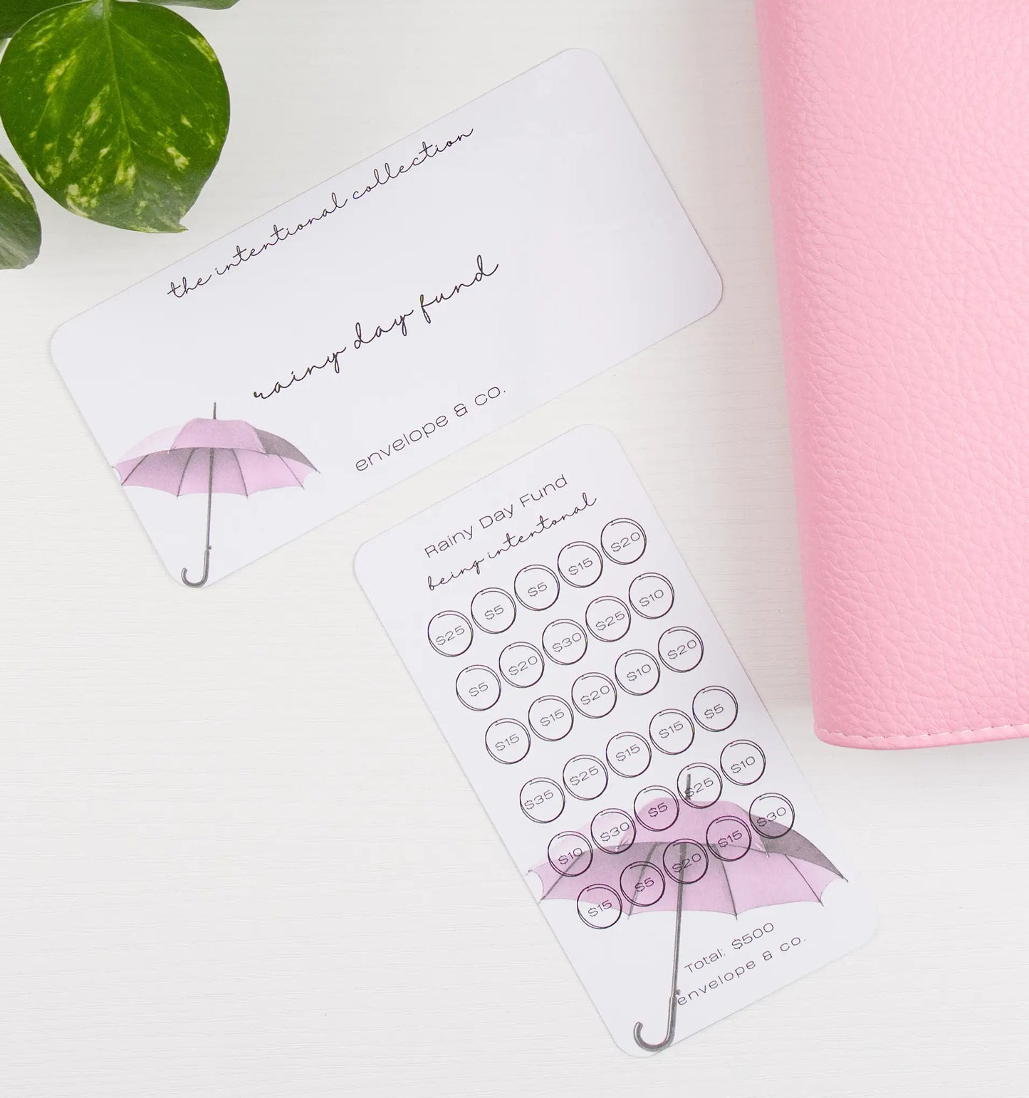 Savings bundle with pink umbrella design on a white surface