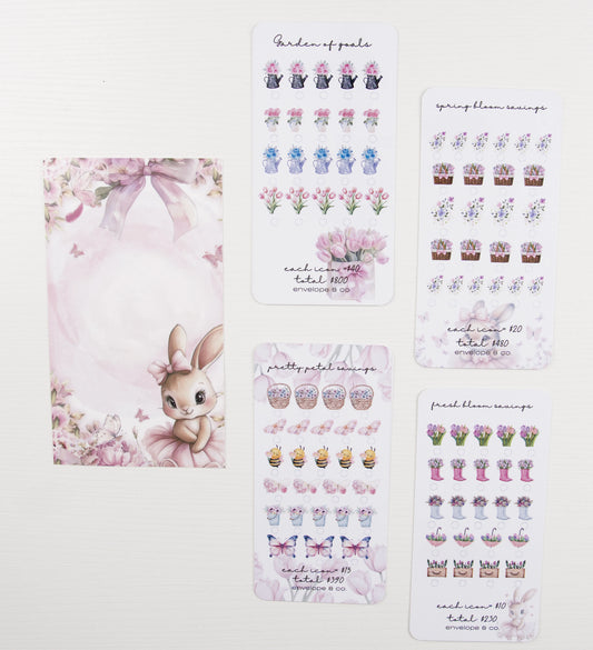 Set of decorative savings trackers with floral and rabbit designs on a white background.