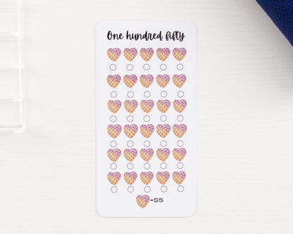 Savings challenge tracker with 30 heart-shaped ice cream waffle cones on white background